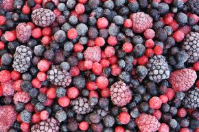 Close up of frozen mixed fruit - berries - red currant, cranberry, raspberry, blackberry, bilberry, blueberry, black currant